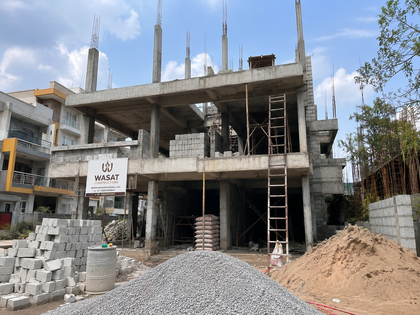 RCC structure work in progress on a 3 BHK house construction site in Bangalore