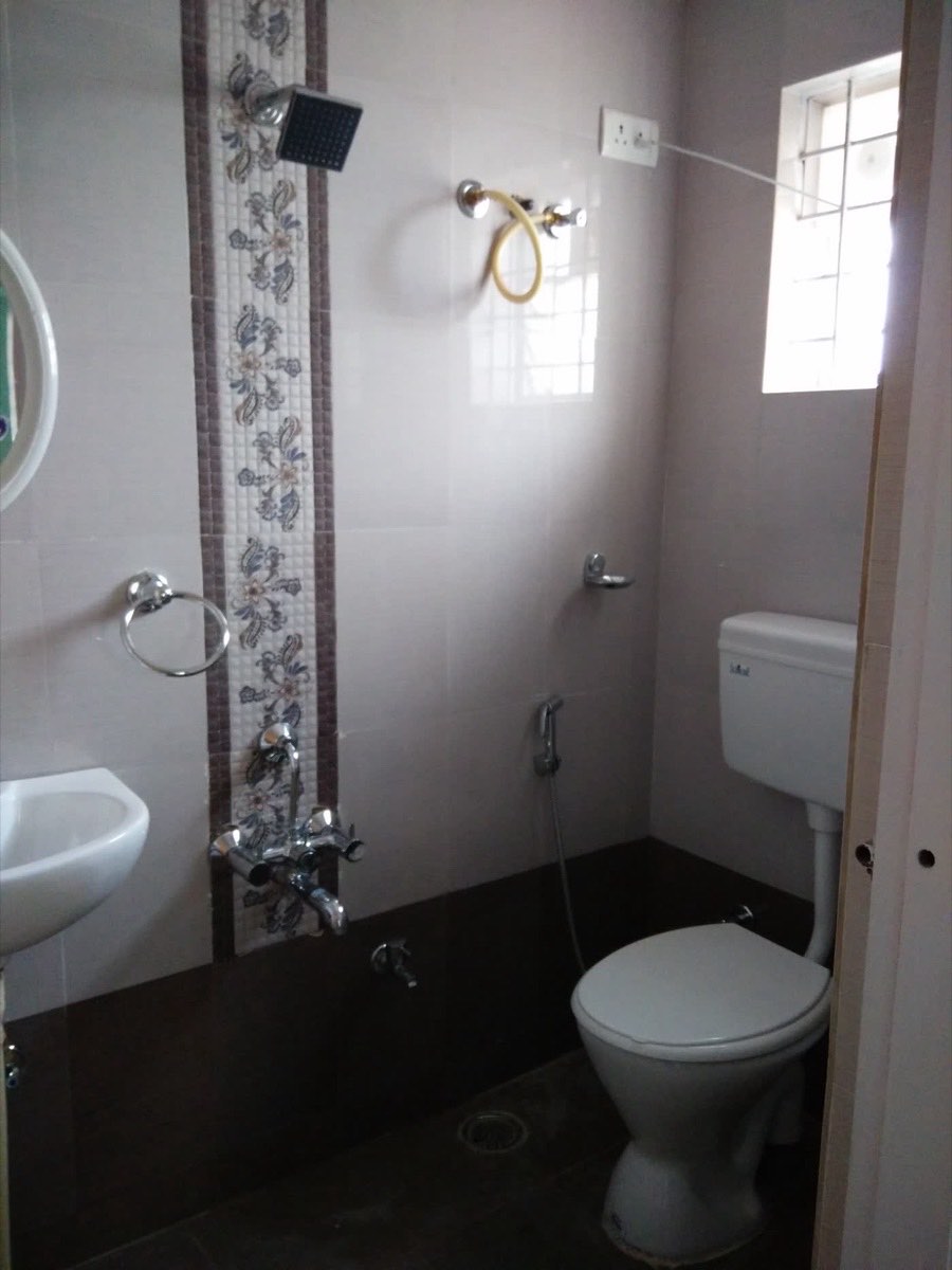 Finished bathroom with tiles and sanitary fittings in a completed Wasat Constructions home